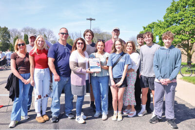  Julie Petkoff, fourth from left in the front row, thanked the Holy Cross Classic Cruisers for honoring her dad, Dan Habel, who passed away in December. 