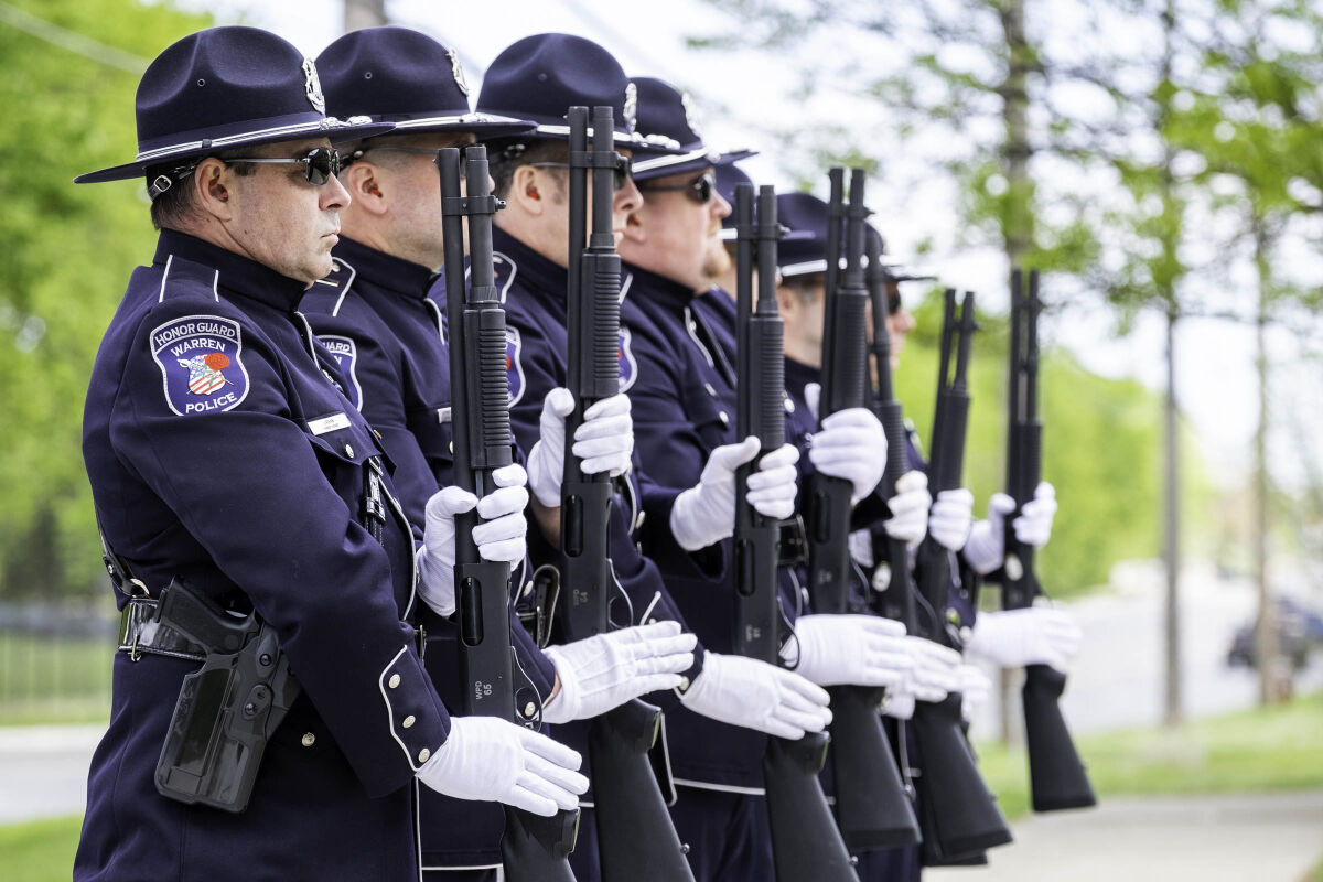  Members of the Warren Police Honor Guard stand at attention during a memorial service for fallen officers on May 11 at the Fraternal Order of Police Lodge No. 124 in Warren.  