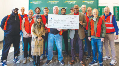  Members of the Senior Men’s Club of Birmingham Foundation present a check to Forgotten Harvest. The foundation fulfills  the club’s focus on community service and philanthropy. 