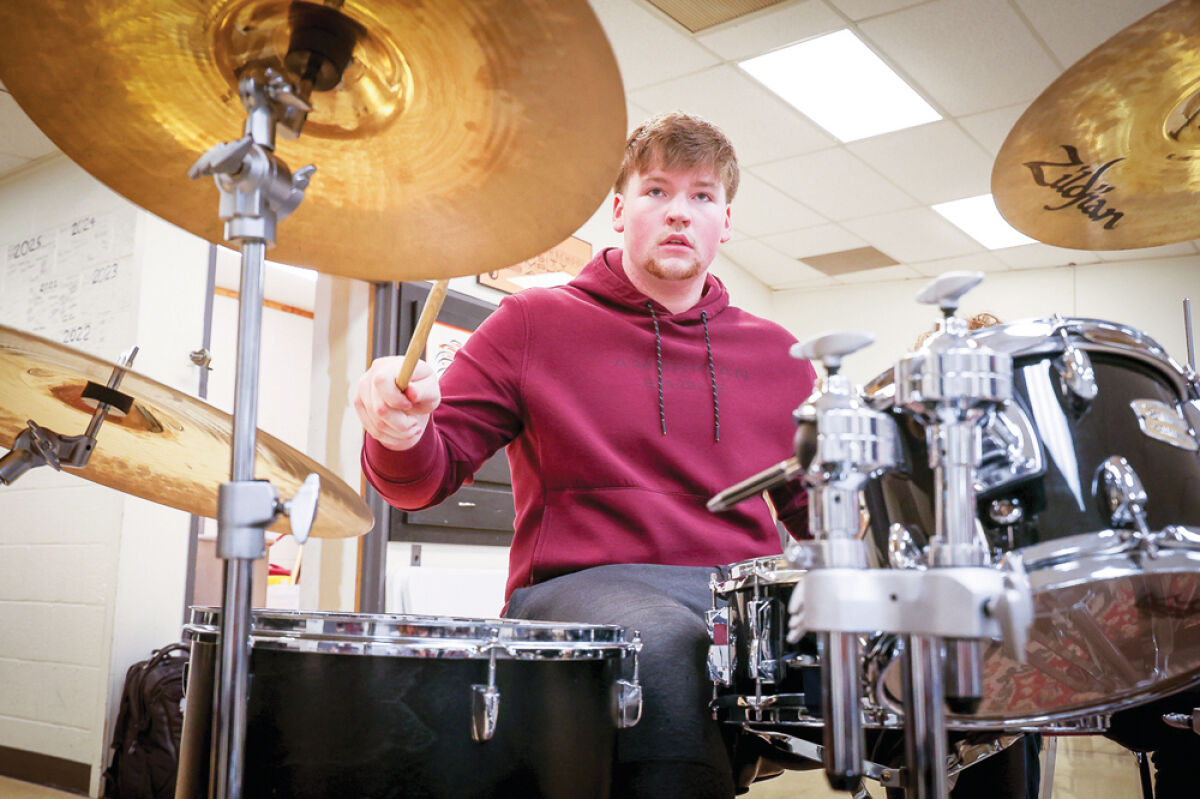  After being named an Outstanding Jazz Musician at the Michigan State Band and Orchestra Jazz Festival, Utica High School senior Nick Frazier, seen here at school May 11,  is considering continuing to perform in small jazz groups as he pursues a career in mechanical engineering. 