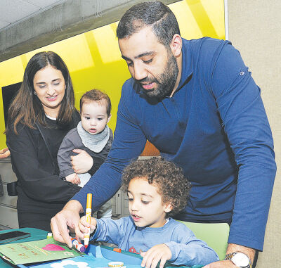  The Alani family were among the guests assembling Mother’s Day cards at the  Troy Public Library May 9, the day before the holiday. 