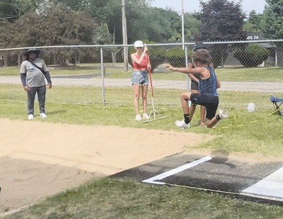  Graham competes in the long jump. 