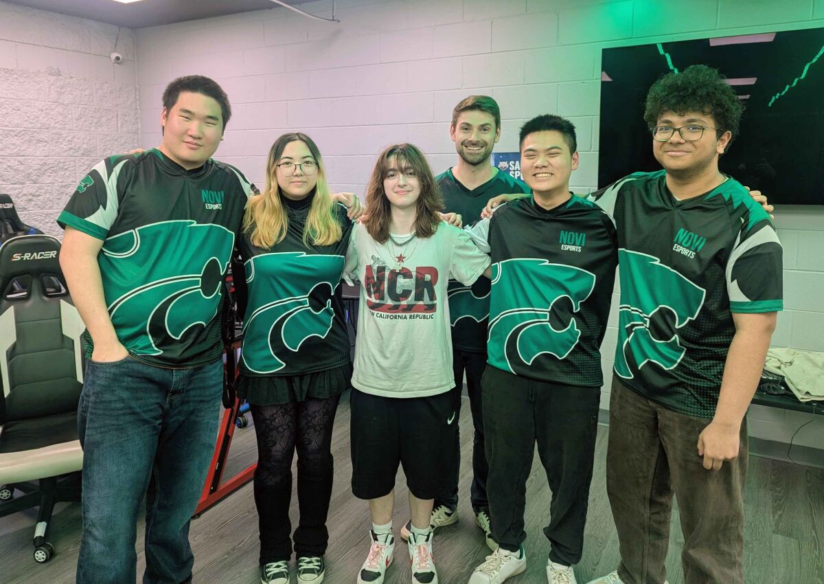  The Novi esports Overwatch 2 team, which won its state final, poses for a photograph after the virtual tournament. 