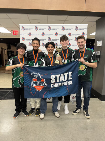  The Novi High School esports Super Smash Bros. team celebrates after winning the Michigan High School Esports League state title. 