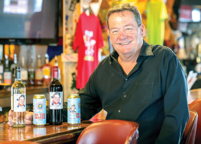  Mike LeFevre, owner of Mike’s on the Water, shows some of his custom drinks. 