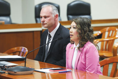  Xiong, right, and Roseville City Manager Ryan Monroe testify before the House Labor and Economic Opportunity Committee May 11 in Lansing. 