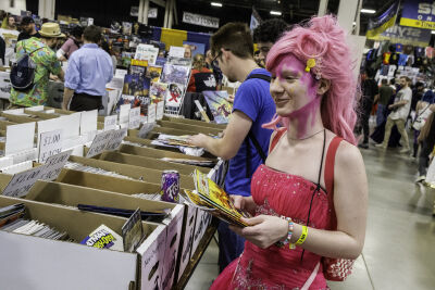 Anthony Jakes, 19, of Mount Clemens, looks through boxes of comic books Saturday, May 16, 2026, at Motor City Comic Con while cosplaying as Pinkie Pie from “My LIttle Pony.” 