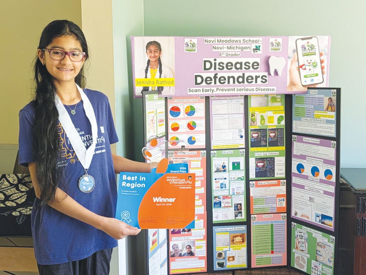  Jenisha Rathod, Michigan Invention Convention grand prize winner, shows the awards she won this year in the state Invention Convention competition. 