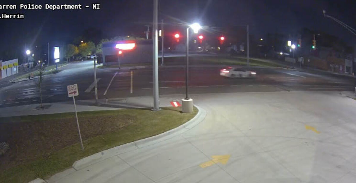  Footage obtained by the Warren Police Department shows a white Chevy Malibu driving away from the scene of a crash on Van Dyke Avenue on May 16. 