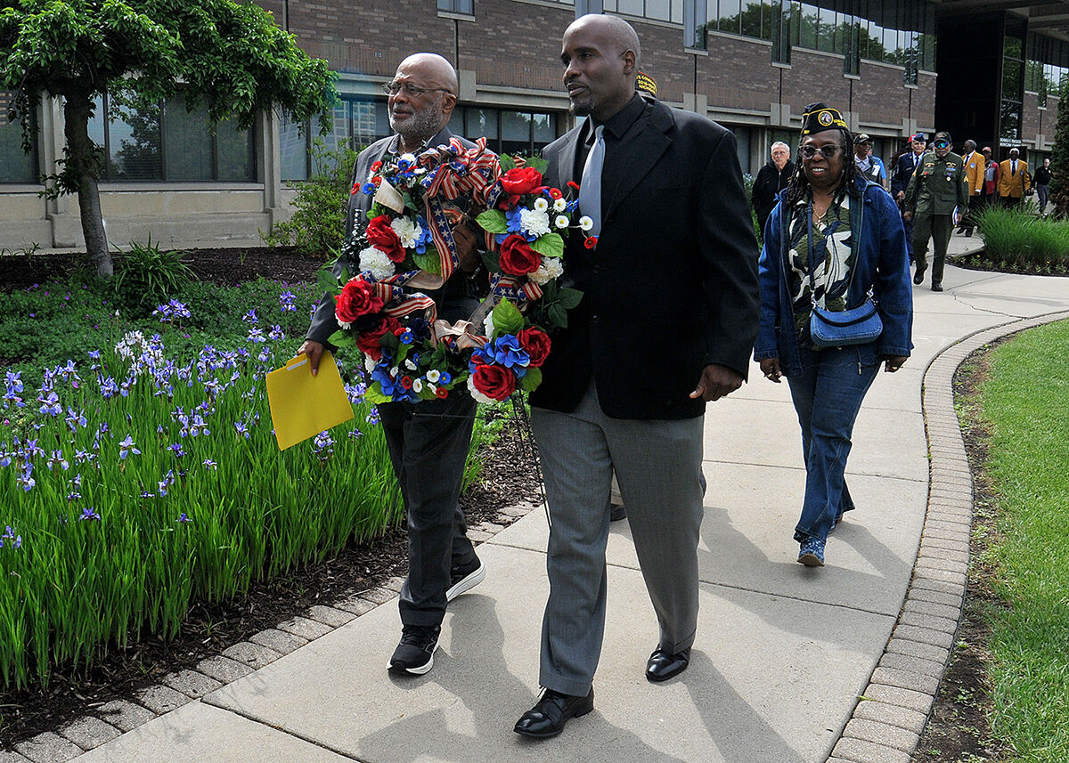  Southfield Veterans' Commissioners John Eley, left, and Chaka McDonald, right, lead a group of veterans during a wreath presentation at the Southfield Municipal Campus as part of the city’s annual Memorial Day ceremony on May 22. 
