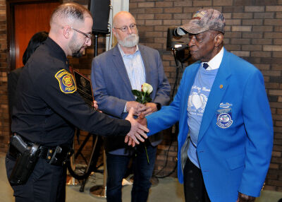  Southfield Police Lt. Mo Bzeih presents a special recognition award to United States Army veteran Donald Carter during the Southfield Memorial Day Ceremony. Carter, 99, is a member of the illustrious Tuskegee Airmen who achieved the rank of captain during his service. 