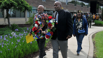 Southfield Veterans' Commissioners John Eley, left, and Chaka McDonald, right, lead a group of veterans during a wreath presentation at the Southfield Municipal Campus as part of the city&rsquo;s annual Memorial Day ceremony on May 22. 