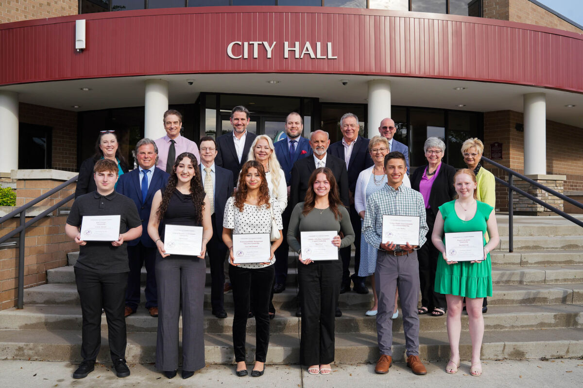  HL-SHscholarships5 Sterling Heights Area Community Foundation scholarship winners stand with foundation board representatives and Sterling Heights City Council members following a May 19 award ceremony. 