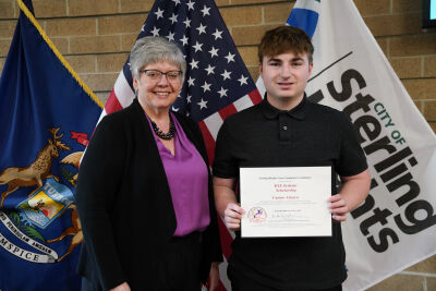  Sterling Heights Area Community Foundation treasurer Angie Lommen presented Stevenson High School senior Carson Ahearn with the BAE Systems scholarship.  