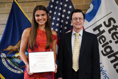  Henry Ford II High School senior Gianna D’Angelo stands with Sterling Heights Area Community Foundation board member Ronald Himmler. She was one of three recipients of science scholarships funded by Himmler. 