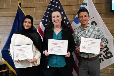  Sterling Heights Area Community Foundation board member Melanie Davis is flanked by scholarship recipients Zeina Faour and Luke Mulka. Davis is holding the award for Cayla Thomas, who could not attend the May 19 award ceremony. 