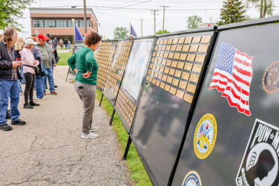  Attendees of the city of Utica’s annual Memorial Day ceremony view Michigan's Traveling Memorial of Fallen Military, which included the names of all Michigan soldiers, sailors, Marines and airmen who lost their lives defending the country since 1990. 