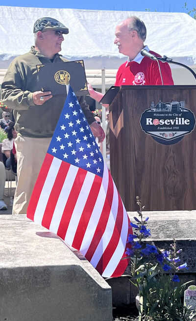  Roseville Mayor Robert Taylor, right, presents a certificate of appreciation to Paul Martinez, who was the first-ever parade veteran grand marshal at the city’s Memorial Day parade May 25.  