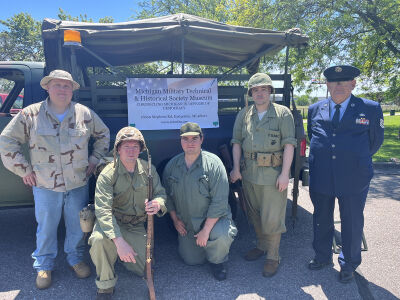  From left, Chris Causley, Michigan Military Technical and Historical Society president; reenactors Joseph R. Gudobba, William Costine and Joe Coppens; and U.S. Air Force veteran Franklin Newman pose for a photograph on Memorial Day. 
