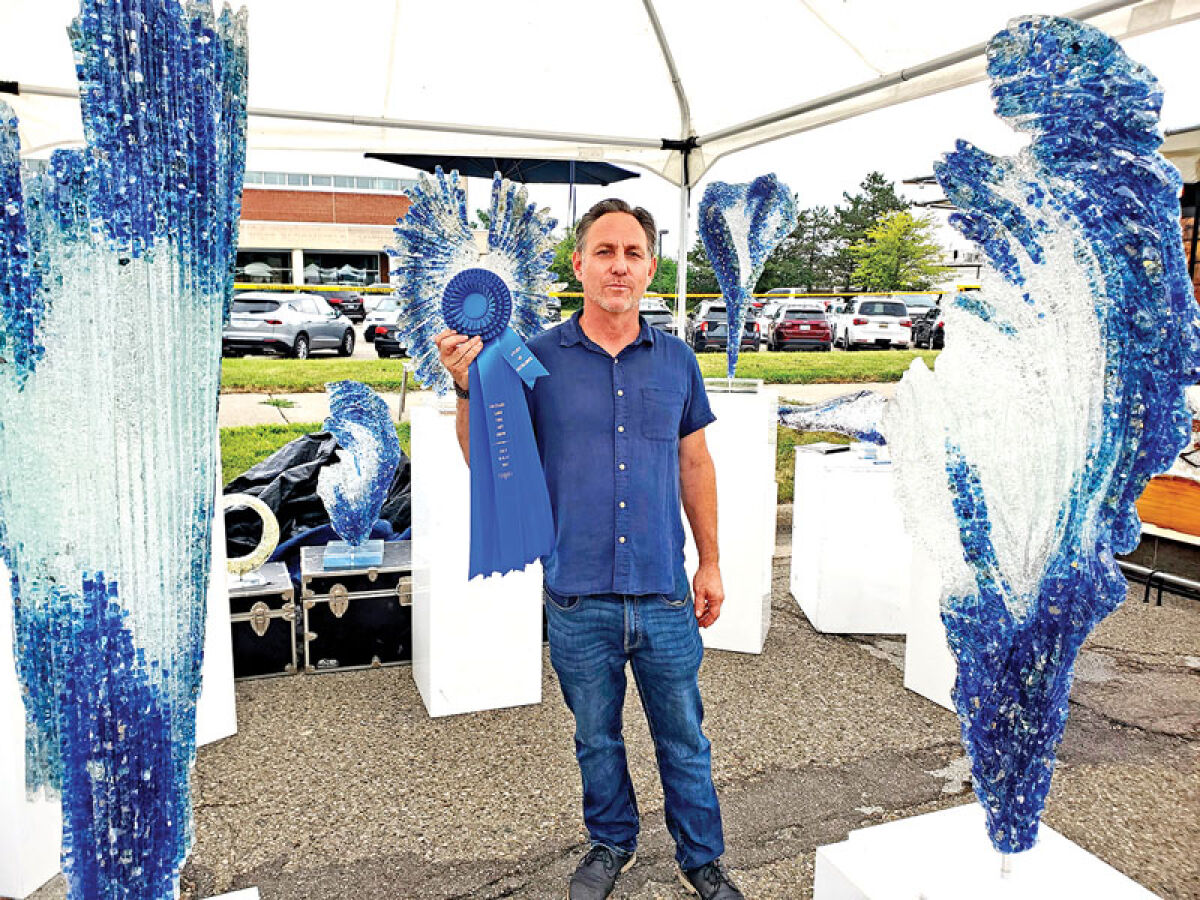  John Denis created this mix of glass and acrylic, “Fusion,” which emits light and color. 