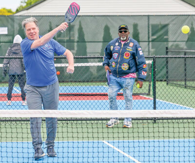  Roseville City Councilman Bill Shoemaker warms up on the pickleball court before playing in a scheduled tournament. Behind him is Maurice “Pastor Moe” Edwards, the new chair of the Roseville Parks and Recreation Board. 
