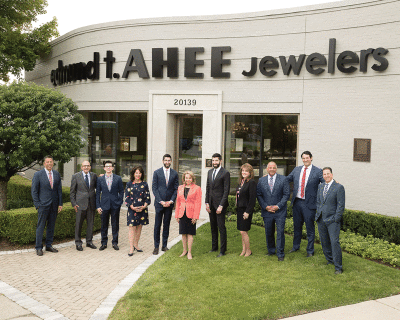  In this 2019 photo, Ahee family members, from left, Greg, John, Zack, Pamela, Andre, Bettejean, Stefan, Gina, Chris, Alex and Peter pose outside the family’s jewelry store in Grosse Pointe Woods. The store is marking its 75th anniversary this year. 