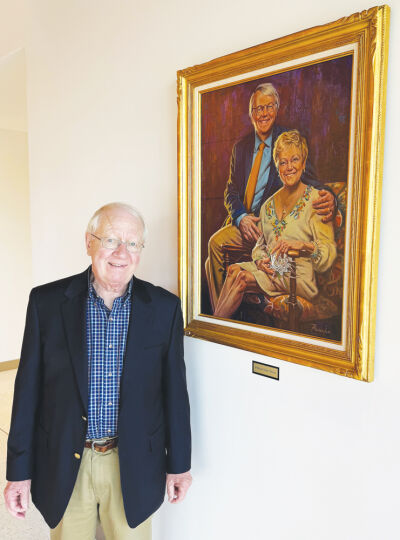  Paul Schaap stands next to a new portrait of him and his late wife, Carol, by artist Robert Maniscalco that’s on display in the recently opened A. Paul and Carol C. Schaap Center for the Performing Arts in Grosse Pointe Park.  