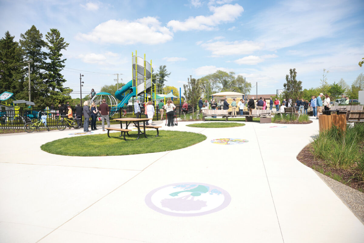  Crowds gather in Brooklands Plaza May 21 for a ribbon-cutting ceremony. 