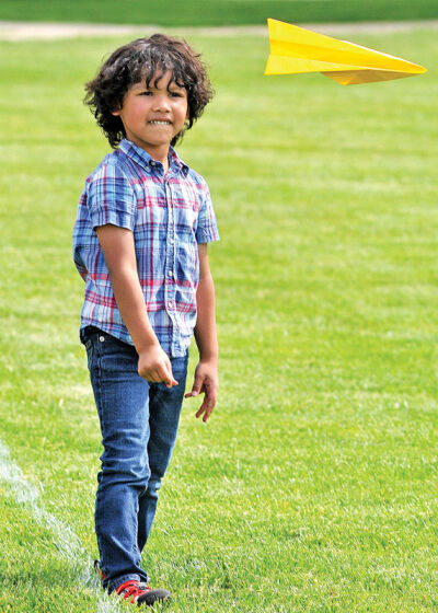  Ascher Mackles, 5, watches as his paper airplane glides through the air at Southfield’s event for National Paper Airplane Day on May 26. 