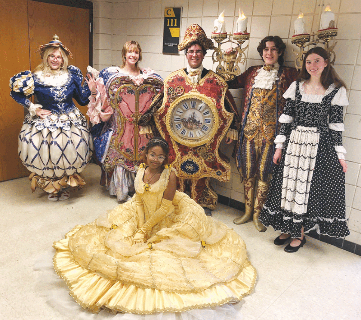  Cast members from Grosse Pointe North High School’s production of “Beauty and the Beast” don the intricate costumes that they’ll be wearing onstage this month. 