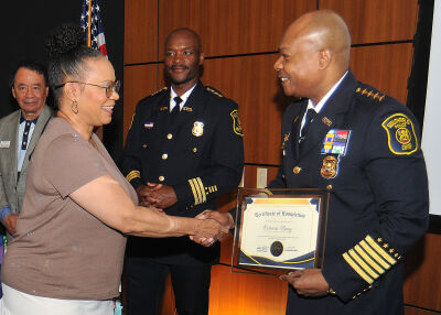  Southfield Police Chief Elvin V. Barren congratulates Octavia Baez on her graduation from the Citizens Police Academy. Baez is one of 24 graduates this year. 