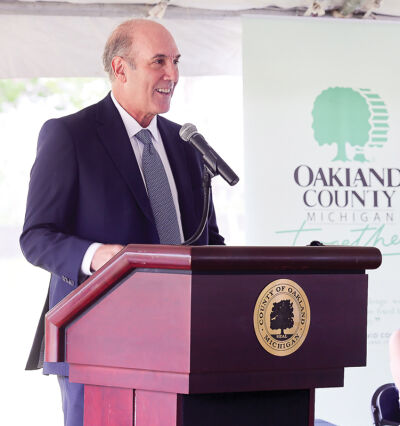  Three Oaks Communities CEO Bill Godfrey speaks about the company’s neuro-inclusive neighborhood model, which allows low income adults with intellectual and development disabilities to live more independently in homes they own at the groundbreaking of Auburn Oaks June 4. 