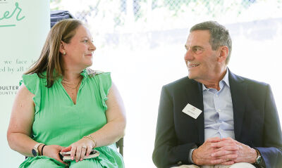  Laurel Seizert, a future resident of Auburn Oaks,  and her father, Gerry Seizert, share  a special moment after speaking at the  groundbreaking of Auburn Oaks June 4. 