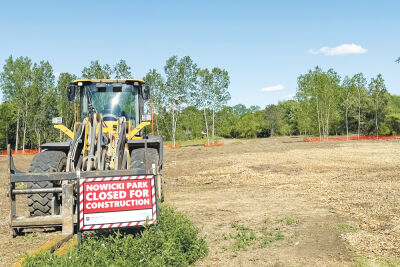  Construction crews have cleared portions of the park to make way for new feature, including a playground, dog park, community room, trails, a pond, parking and more.  