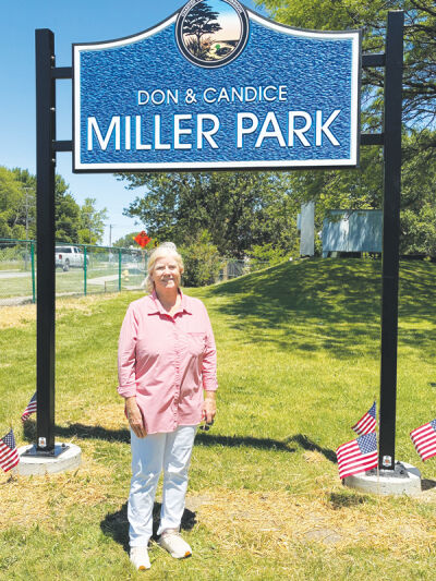  Macomb County Public Works Commissioner Candice Miller stands under the sign dedicating the park to her husband, Don Miller, and herself. 
