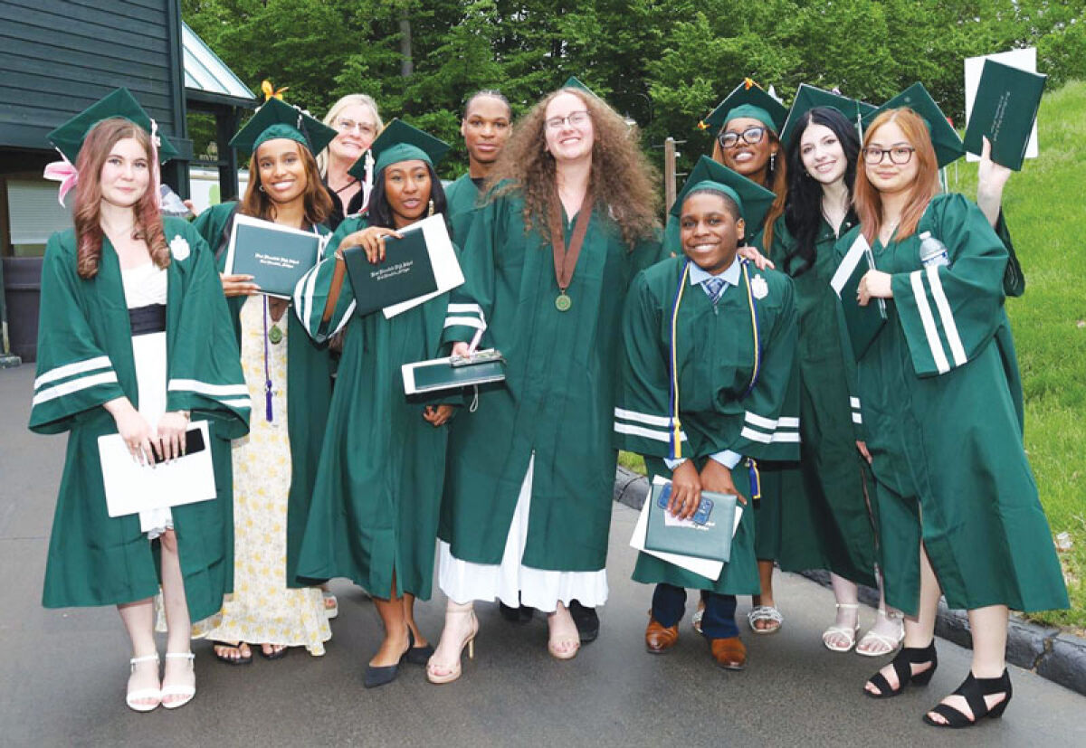  Members of the 2026 graduating class celebrate receiving their diplomas. 
