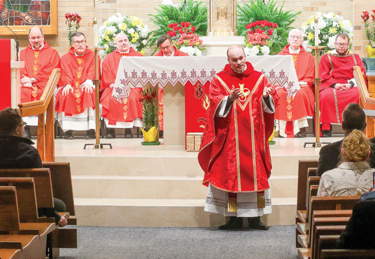  Ordained at the Most Blessed Sacrament Cathedral May 23, Rev. Daniel Whalen celebrates Mass, May 24, at Our Lady of Refuge, the church he grew up attending.  