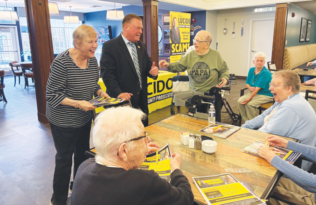  Macomb County Prosecutor Peter Lucido talks to senior citizens about protecting themselves from financial fraud. Lucido has put a special emphasis on safeguarding elderly individuals from financial scams since taking office. 