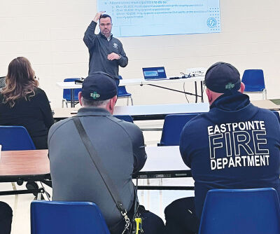  On May 21, Brandon Lewis, director of Emergency Management and Communications at Macomb County Government, talks to first responders at the Recreational Authority of Roseville & Eastpointe building in Roseville. 