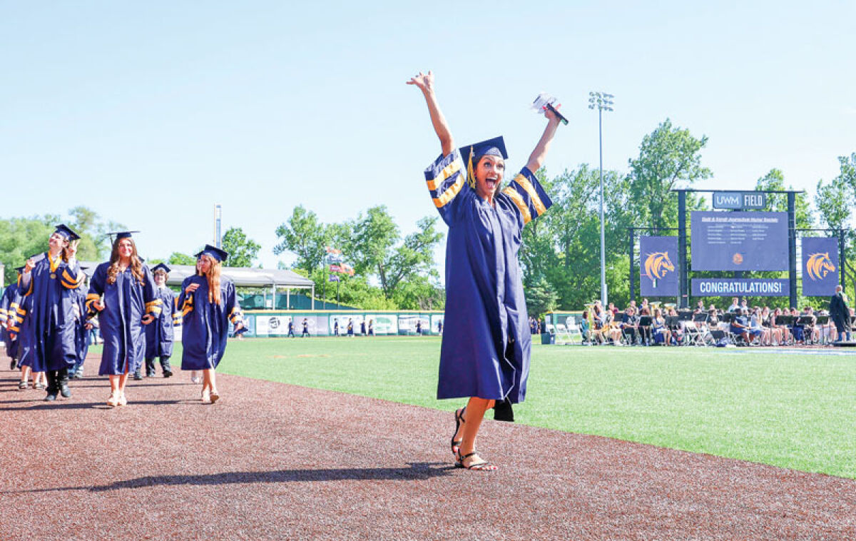  Layla Portis gives a celebratory shout during Fraser High School’s commencement ceremony June 6 at UWM Field. 