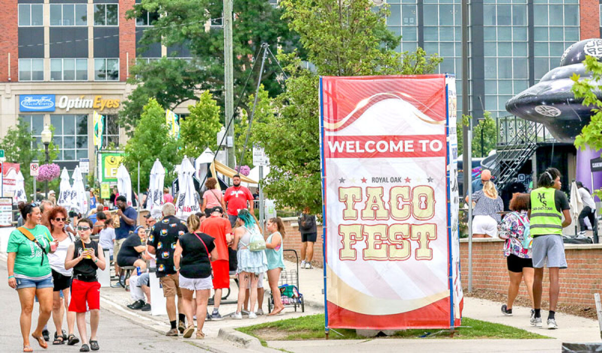  People enjoy the 2024 Royal Oak Taco Fest in the area of Centennial Commons. Taco Fest will return this year July 2-5. 