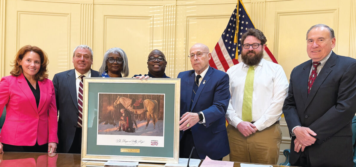  Burgess and Traci Foster present a portrait of Gen. George Washington kneeling in prayer  at Valley Forge to the Grosse Pointe Woods City Council June 1. 