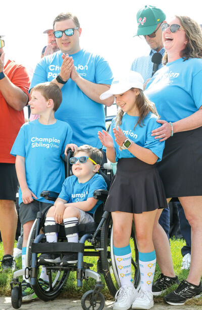  Liz Majewski and family are all smiles as she is presented with the Alma Wahlberg award. 