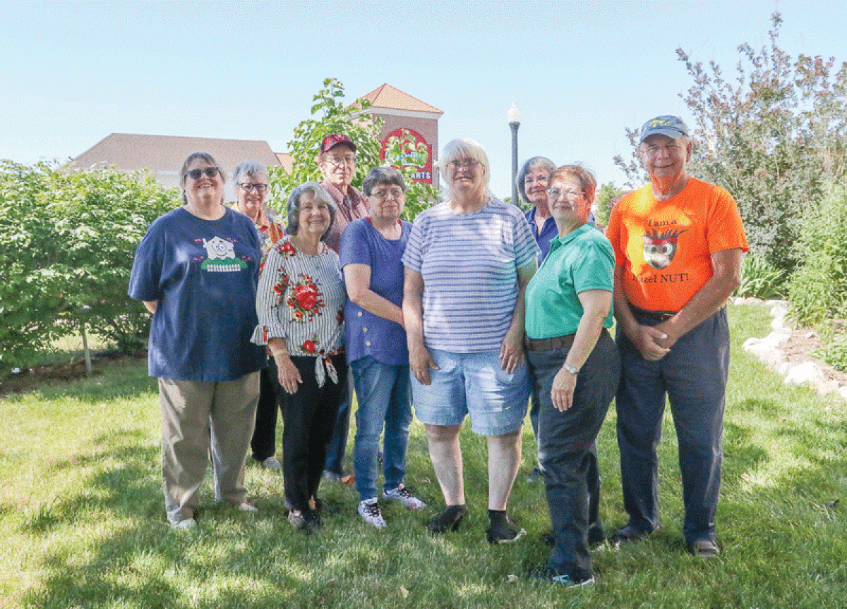  Members of Hazel Park Neighborhood Enrichment gather at the Hazel Park library June 21. Members landscape areas around the city and recognize aesthetically appealing homes with weekly beautification awards. They also organize citywide garage sales and fundraisers for good causes.  