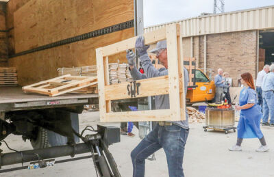  The more than 150 volunteers at the build Nov. 5 were split into groups to perform certain tasks, such as sanding. 