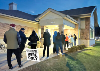  Voters wait outside of Keego Harbor City Hall during the general election Nov. 8. In Keego Harbor, local candidates and proposals were part of the ballot. 