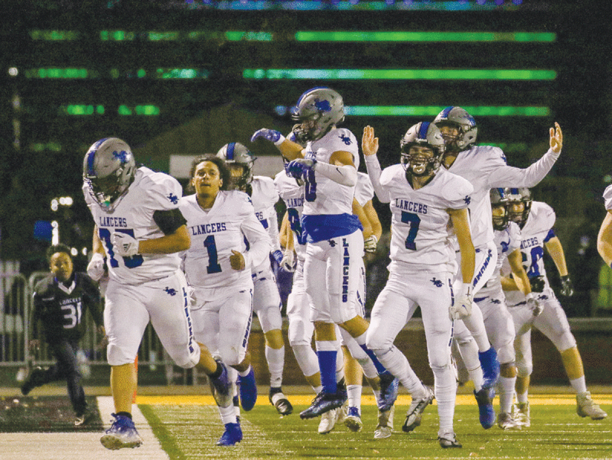  Harrison Township L’Anse Creuse High School takes the field in their regional semifinals game against Macomb Dakota on Nov. 11 at Wayne State University. 