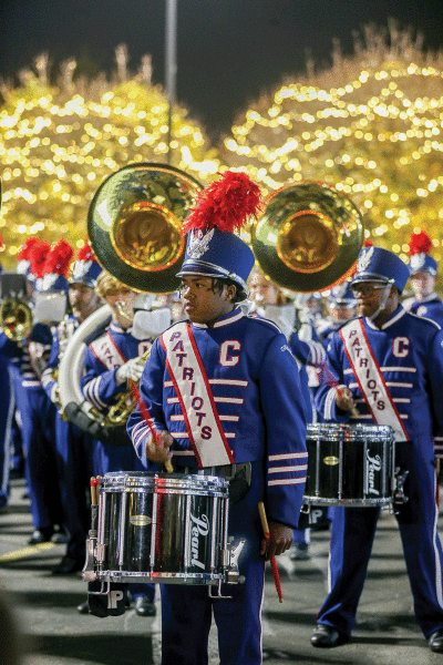  The Cousino High School marching band performs at the Twinkle Town debut Nov. 9 at Gardner White Furniture in Warren. 