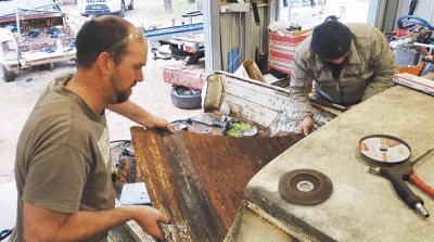  Troy man David Tracy, left, spent weeks fixing up a 1965 Plymouth Valiant with fellow car enthusiast Laurance Rogers, right. 