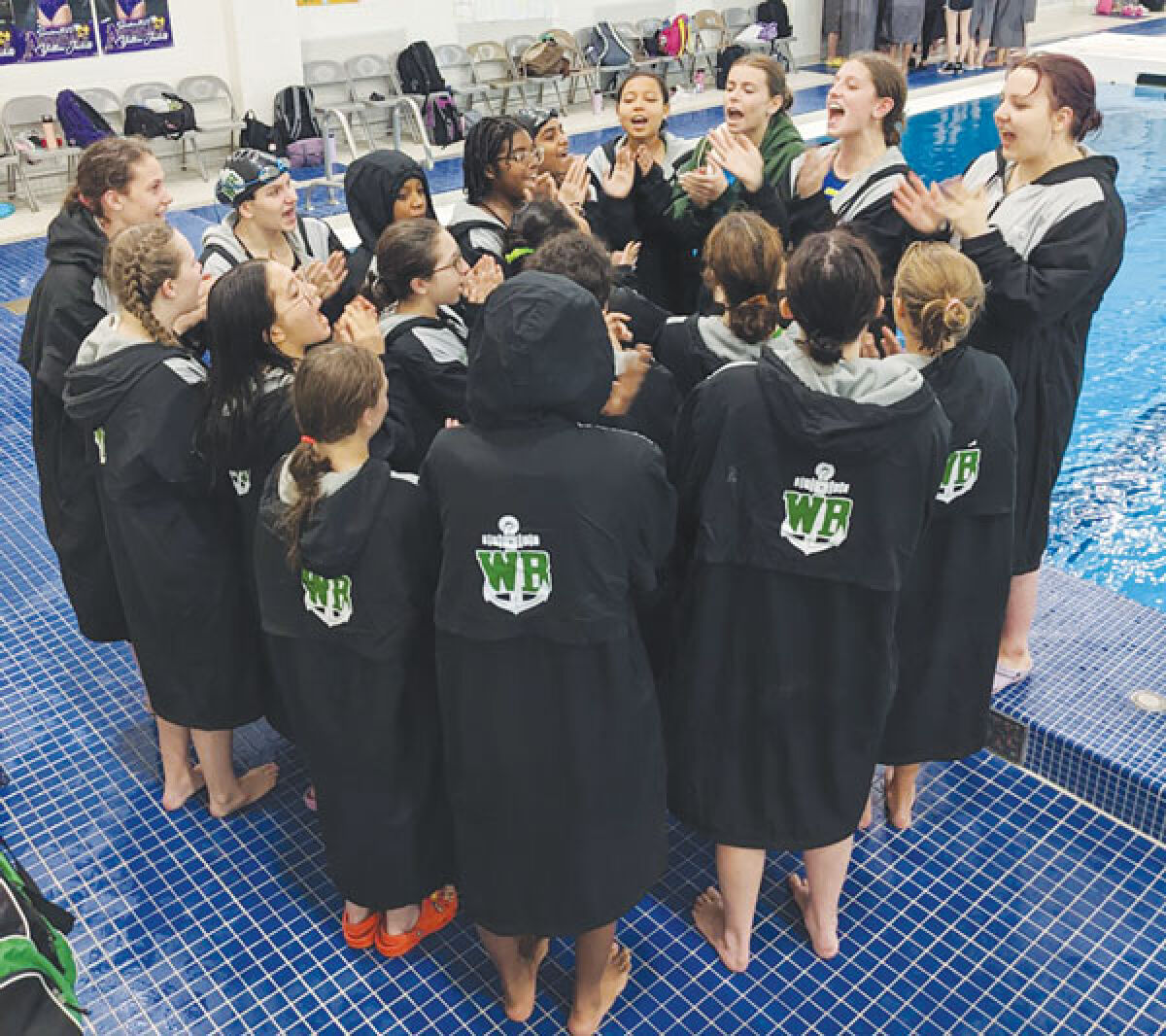  West Bloomfield swim circles up at the MHSAA Division 1 State Finals at Oakland University Nov. 19. 